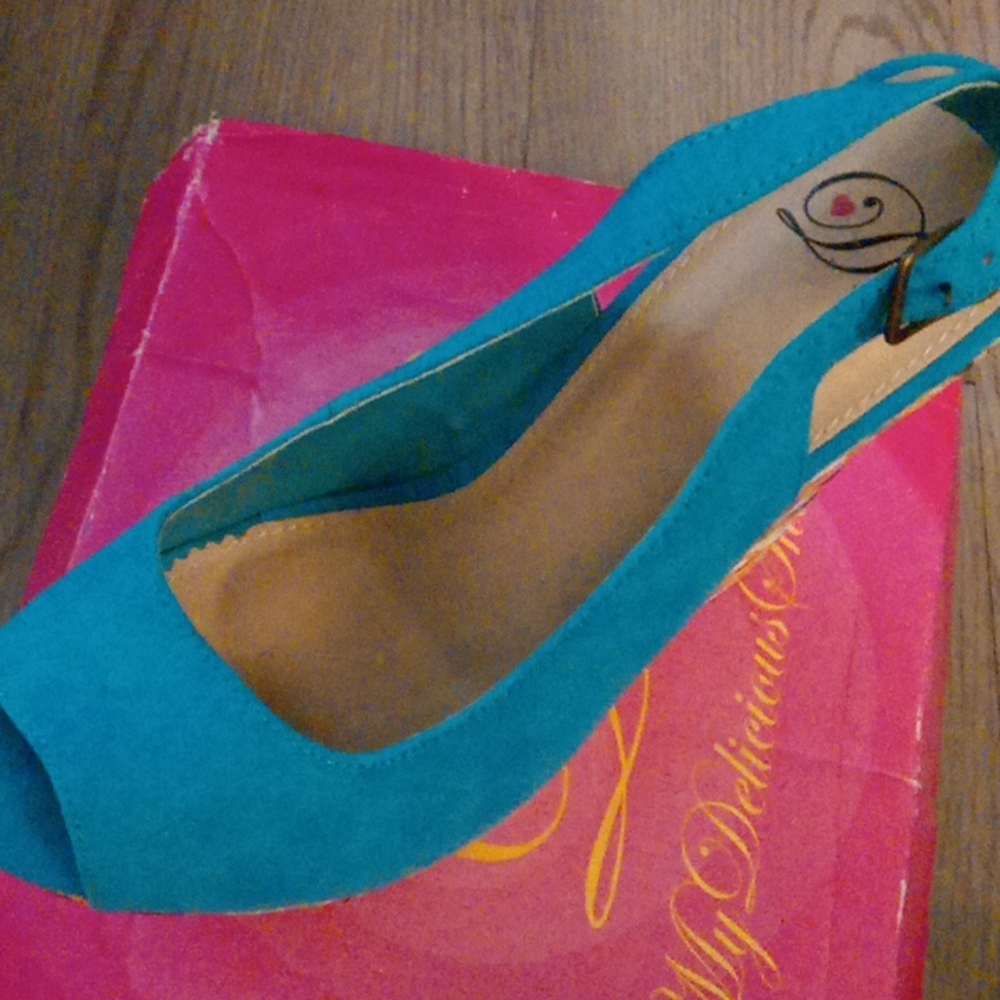 Blue wedge shoes toes out